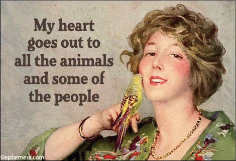 Woman holding a bird with text "My heart goes out to all the animals and some of the people."