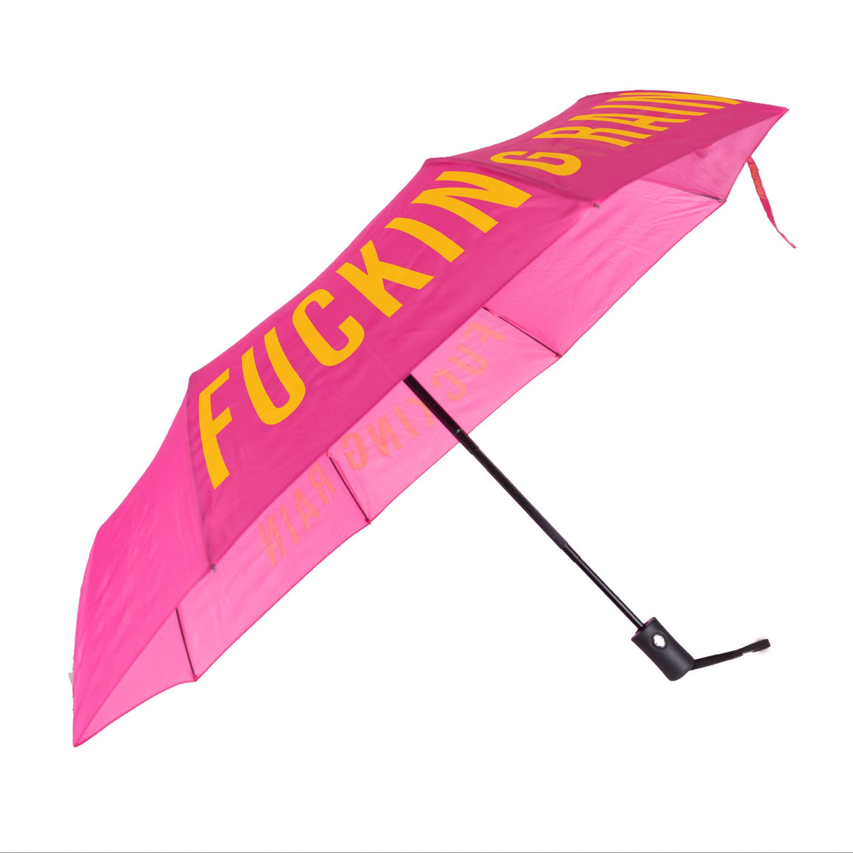 A bright pink folding umbrella with bold yellow text reading 'FUCKING RAIN' on the canopy