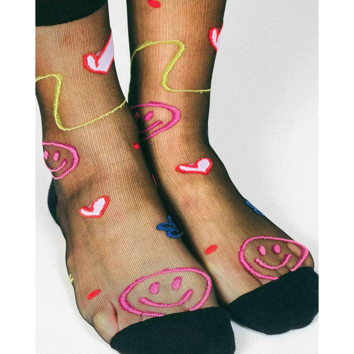 Happy Doodles Sheer Crew Socks by Hannah Packer | Women's Black Lightweight Graphic Socks