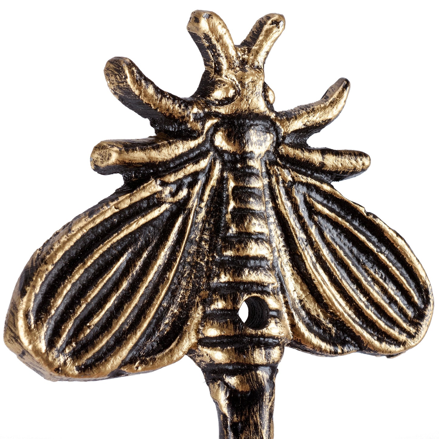 Bronze moth-shaped hook on a white background