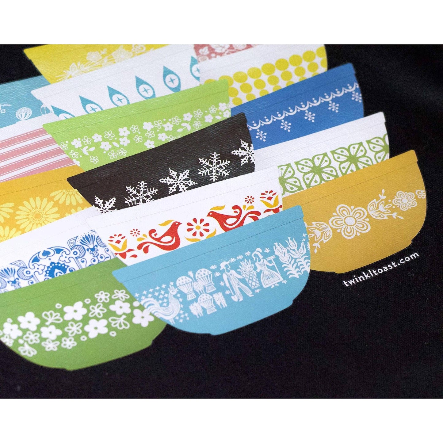 Closeup image of black tote bag with colorful Pyrex-inspired bowl design