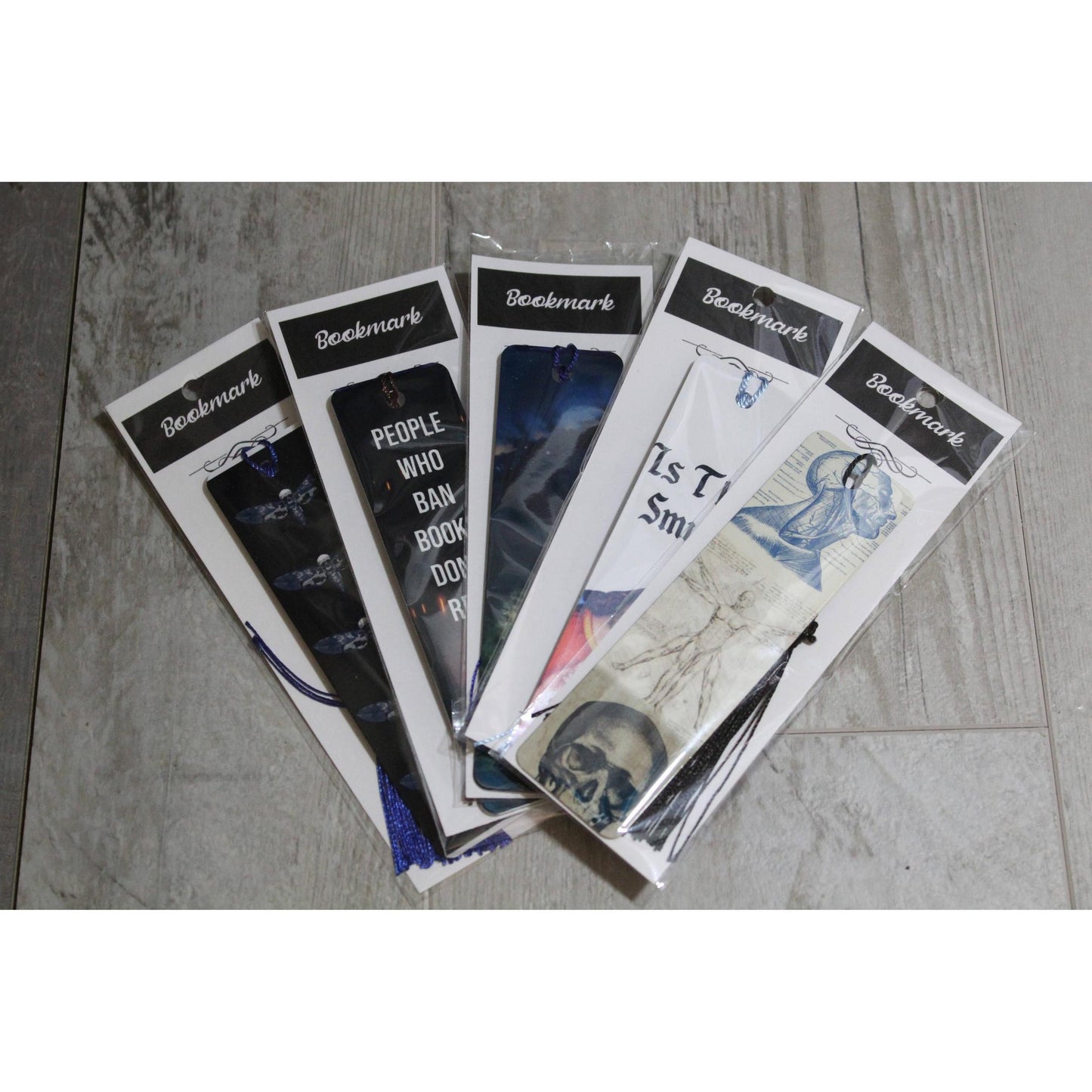 Where You Fell Asleep Metal Bookmark with White Tassle | Skeleton Hand Illustration