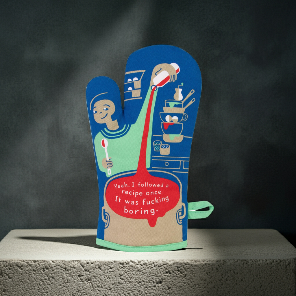 Oven mitt with humorous design and text on a dark background