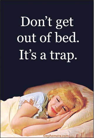 A dark navy graphic with the text 'Don’t get out of bed. It’s a trap.