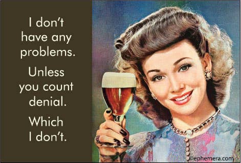 A magnet with a vintage-style illustration of a smiling woman holding a glass of beer on the right, and white text on a dark brown background on the left that reads: "I don't have any problems. Unless you count denial. Which I don't"