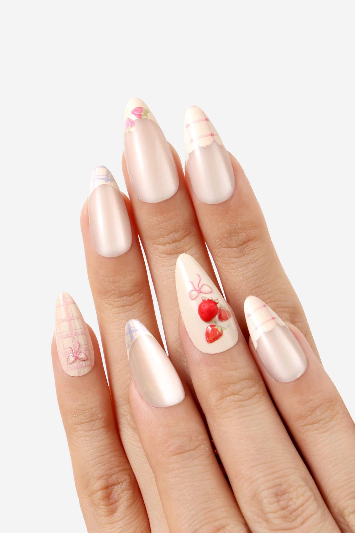 Hand with almond-shaped nails featuring various design