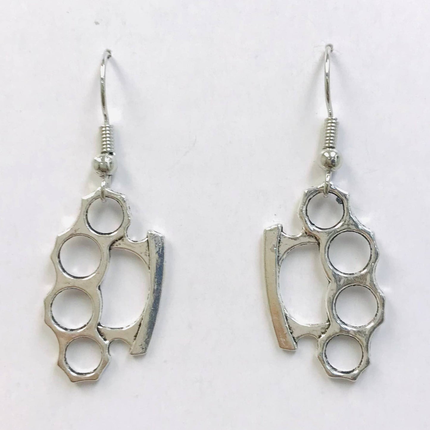 Pair of silver brass knuckle earrings