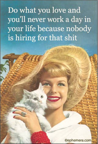 A retro-style printed graphic with the text 'Do what you love and you'll never work a day in your life because nobody is hiring for that shit' above a smiling blonde woman in a white outfit and large hat, holding a white cat in front of a wicker chair.
