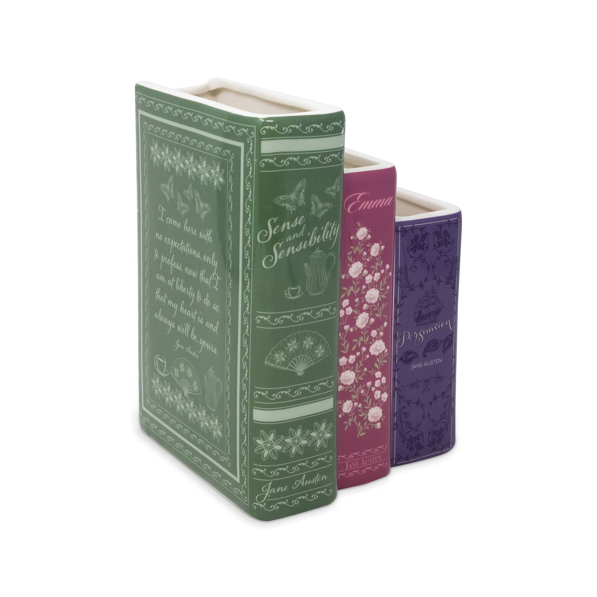 Three decorative book-shaped flower vase, with green, pink, and purple spines featuring floral and script designs.