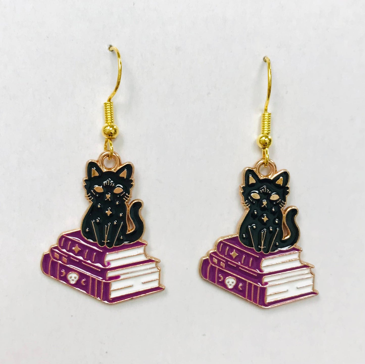 Cat and book earrings