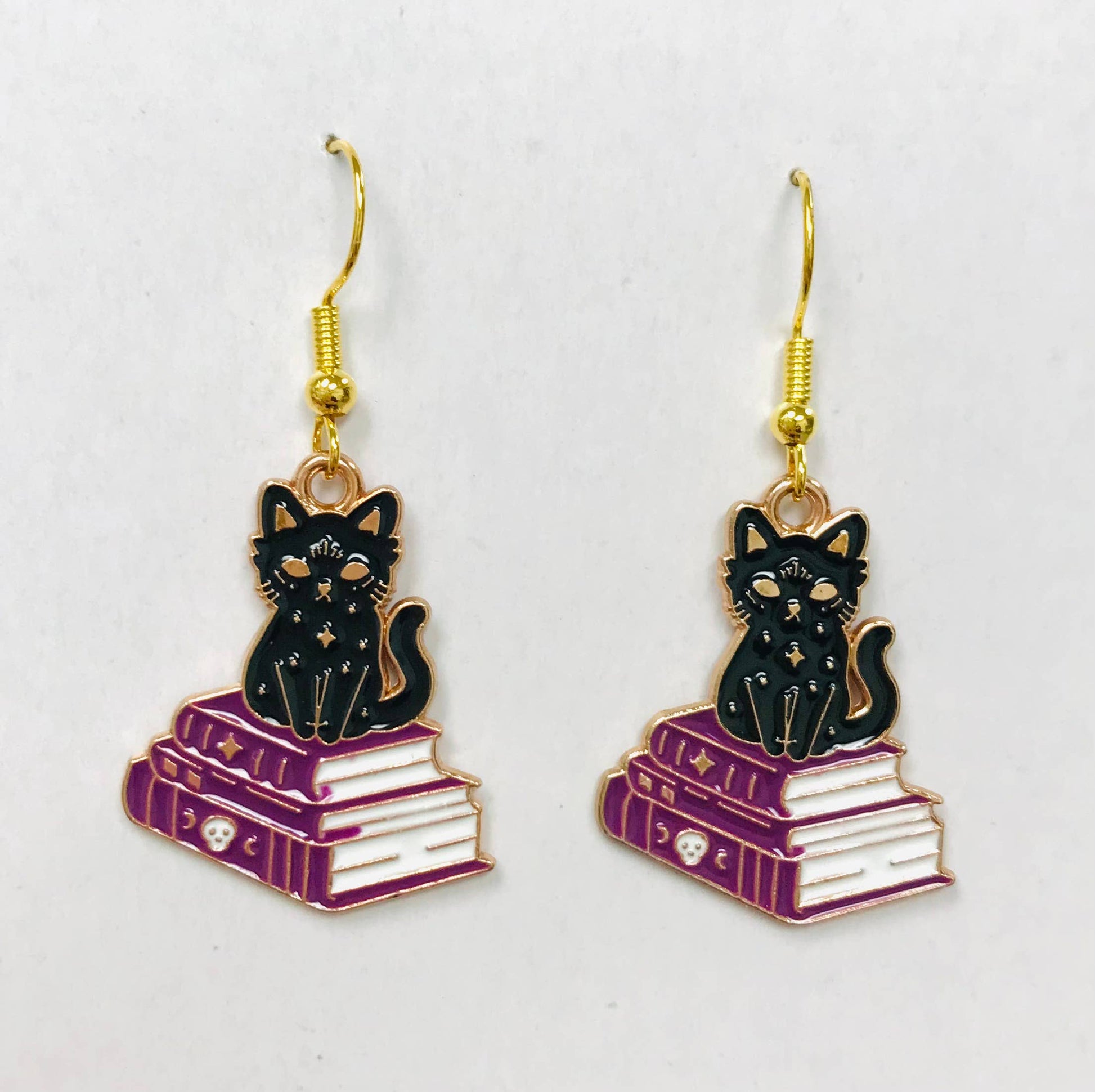 Cat and book earrings