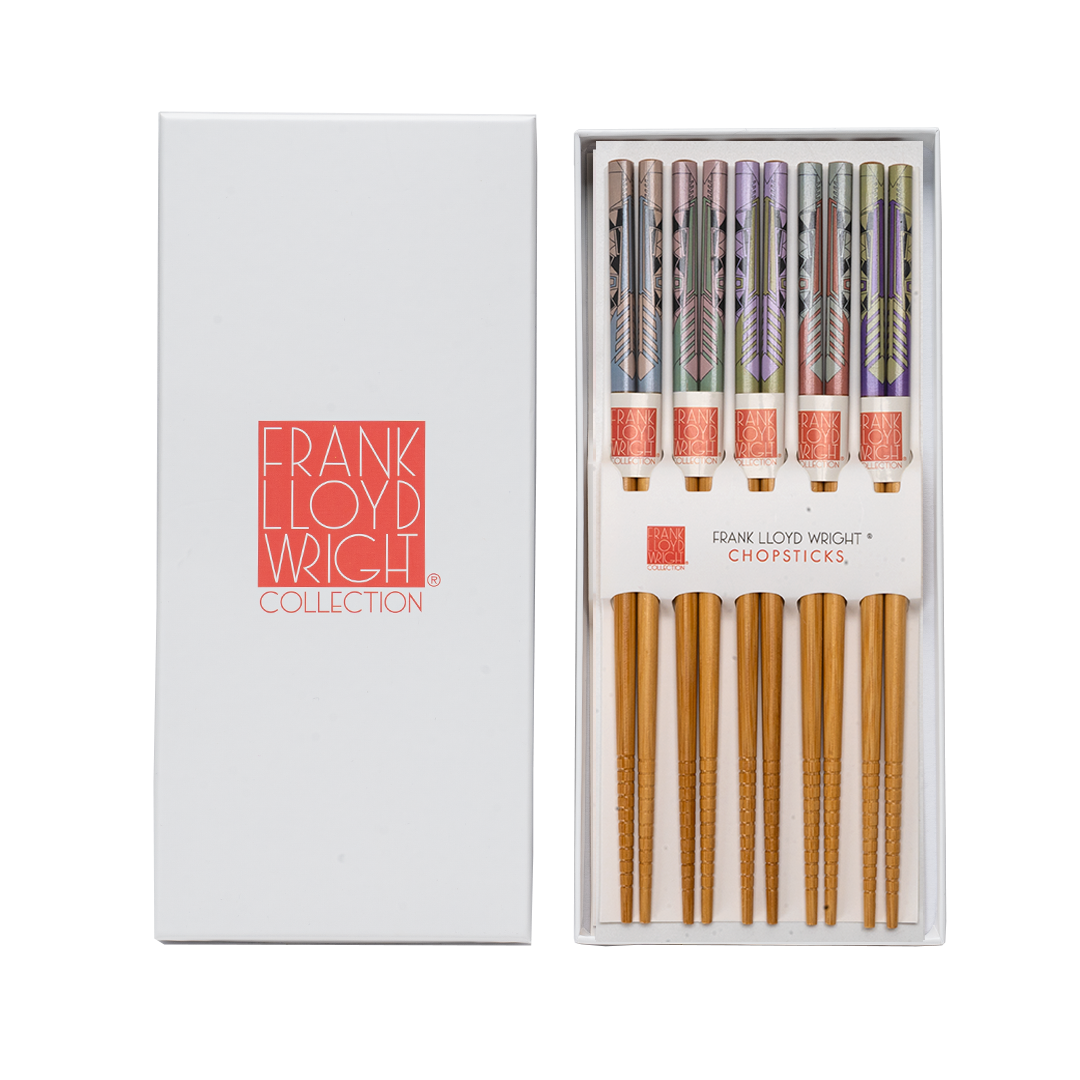 Frank Lloyd Wright Collection chopsticks in a white presentation box, with the left side showing the white box lid and the right side showing the open box containing 5 pairs of chopsticks with patterned handles.