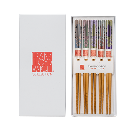 Frank Lloyd Wright Collection chopsticks in a white presentation box, with the left side showing the white box lid and the right side showing the open box containing 5 pairs of chopsticks with patterned handles.