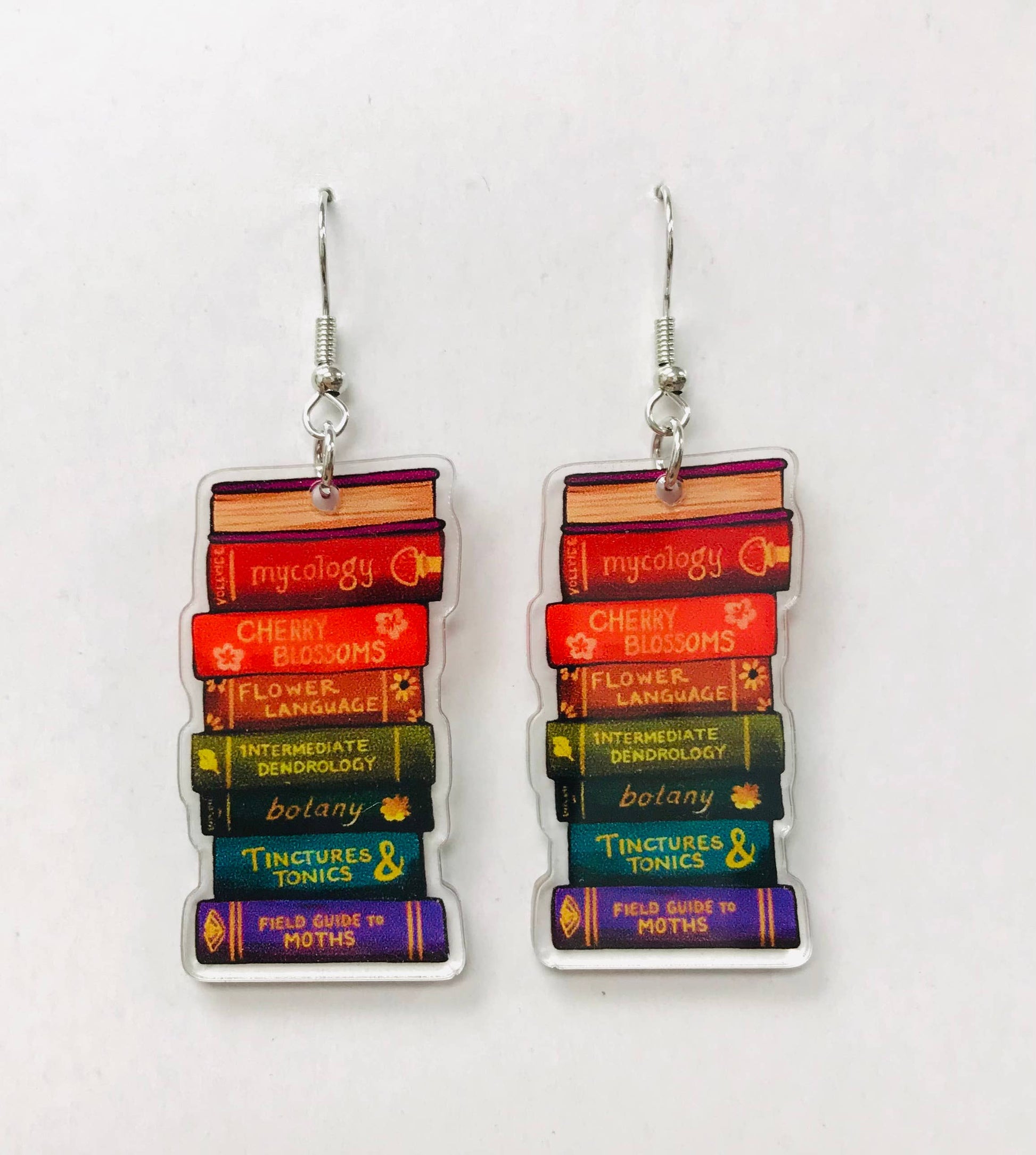 Stacked book-themed earrings