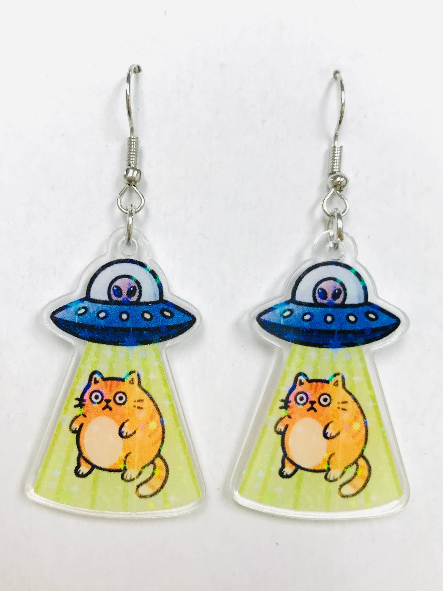 Earrings with alien spaceship and cat design 