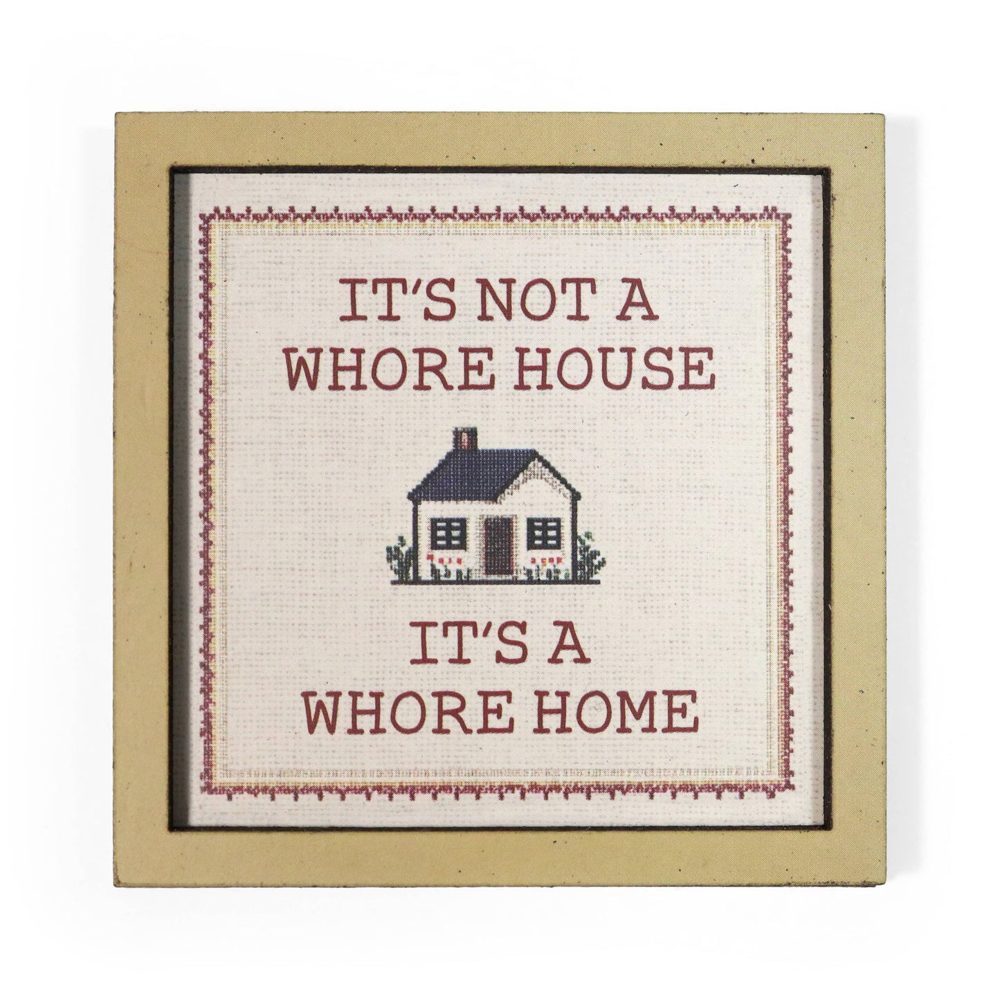 Decorative magnet with text 'It's not a whore house, it's a whore home' and a small house illustration.