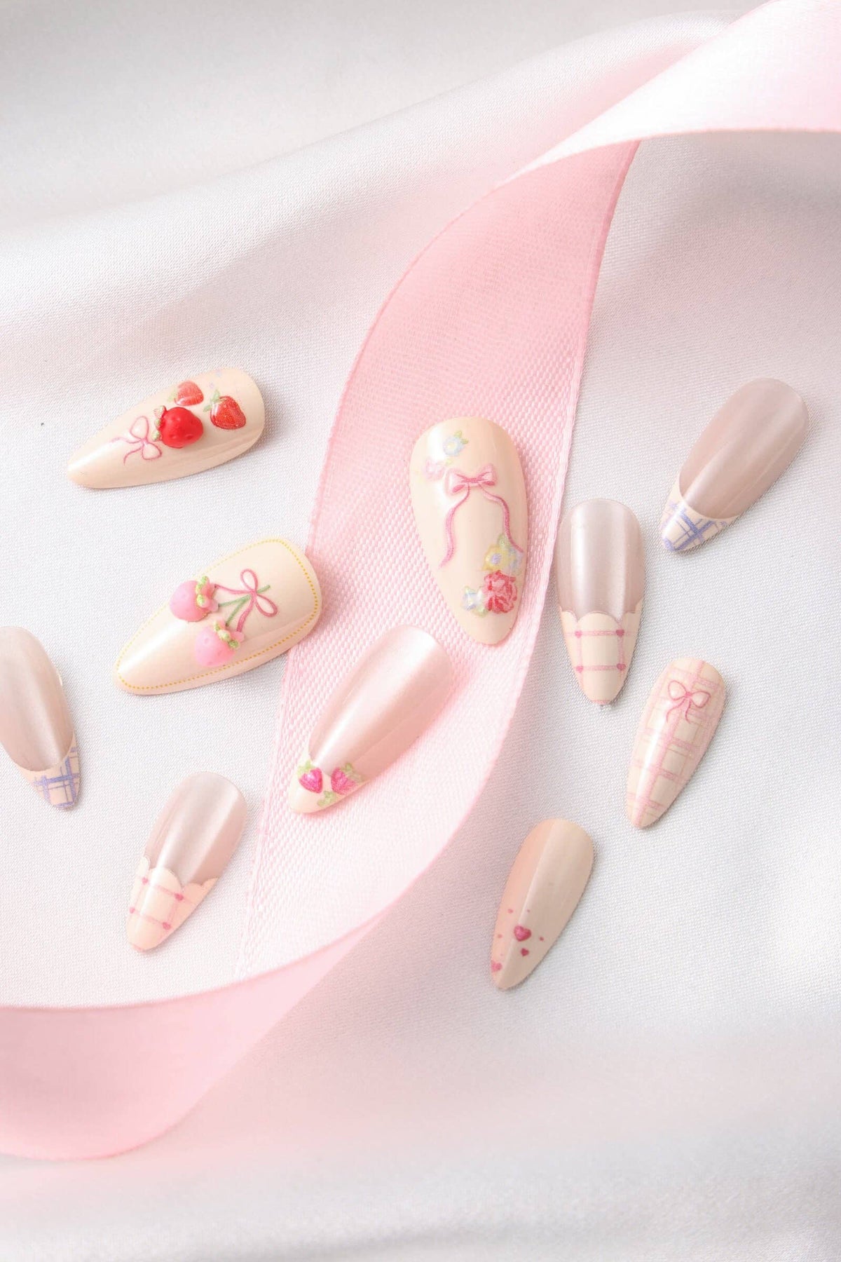 Decorative false nails with floral and heart designs