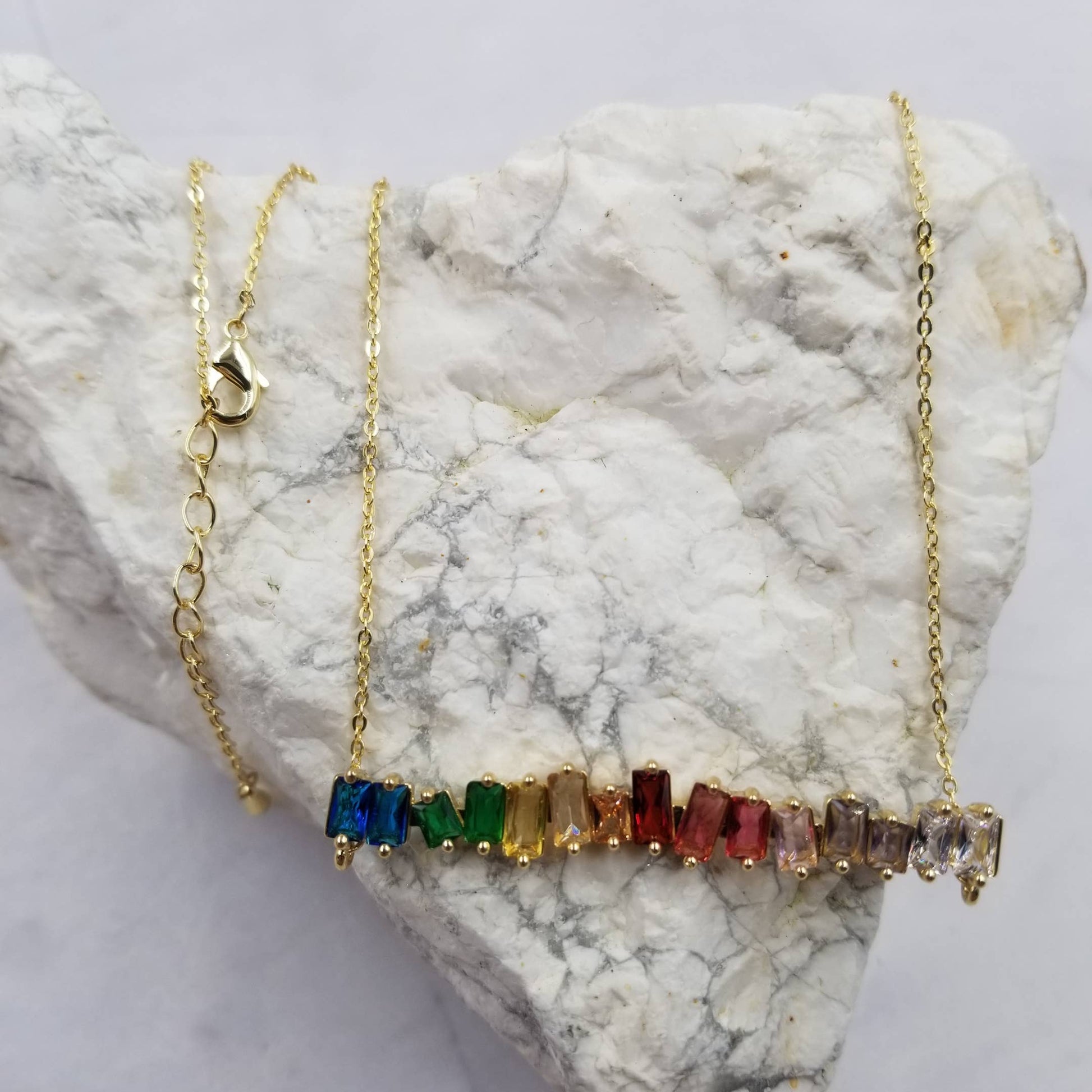 Gold necklace with colorful gemstones 