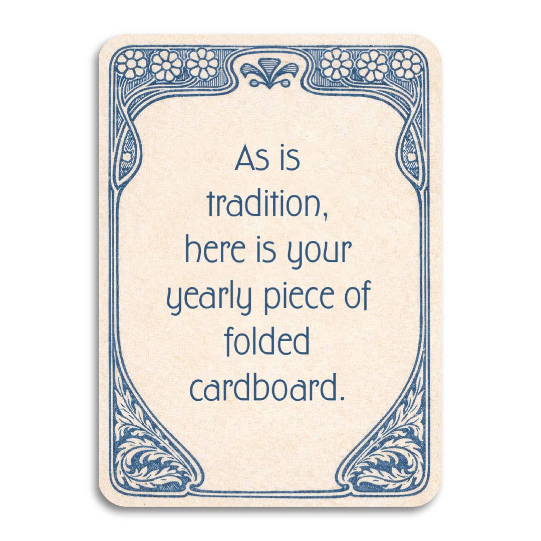 A rectangular cream-colored greeting card with rounded corners, featuring a blue Art Nouveau border and the text, 'As is tradition, here is your yearly piece of folded cardboard.'.
