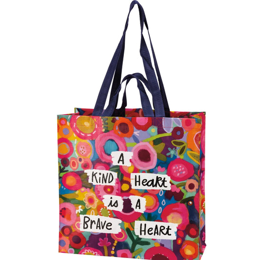 Colorful tote bag with floral pattern and motivational quote on a white background