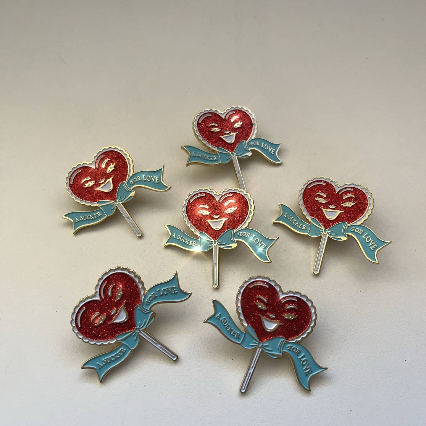 A Sucker For Love Soft Enamel Pin | Heart-Shaped Lollipop with Red Glitter-Kitschy Delish-The Bullish Store