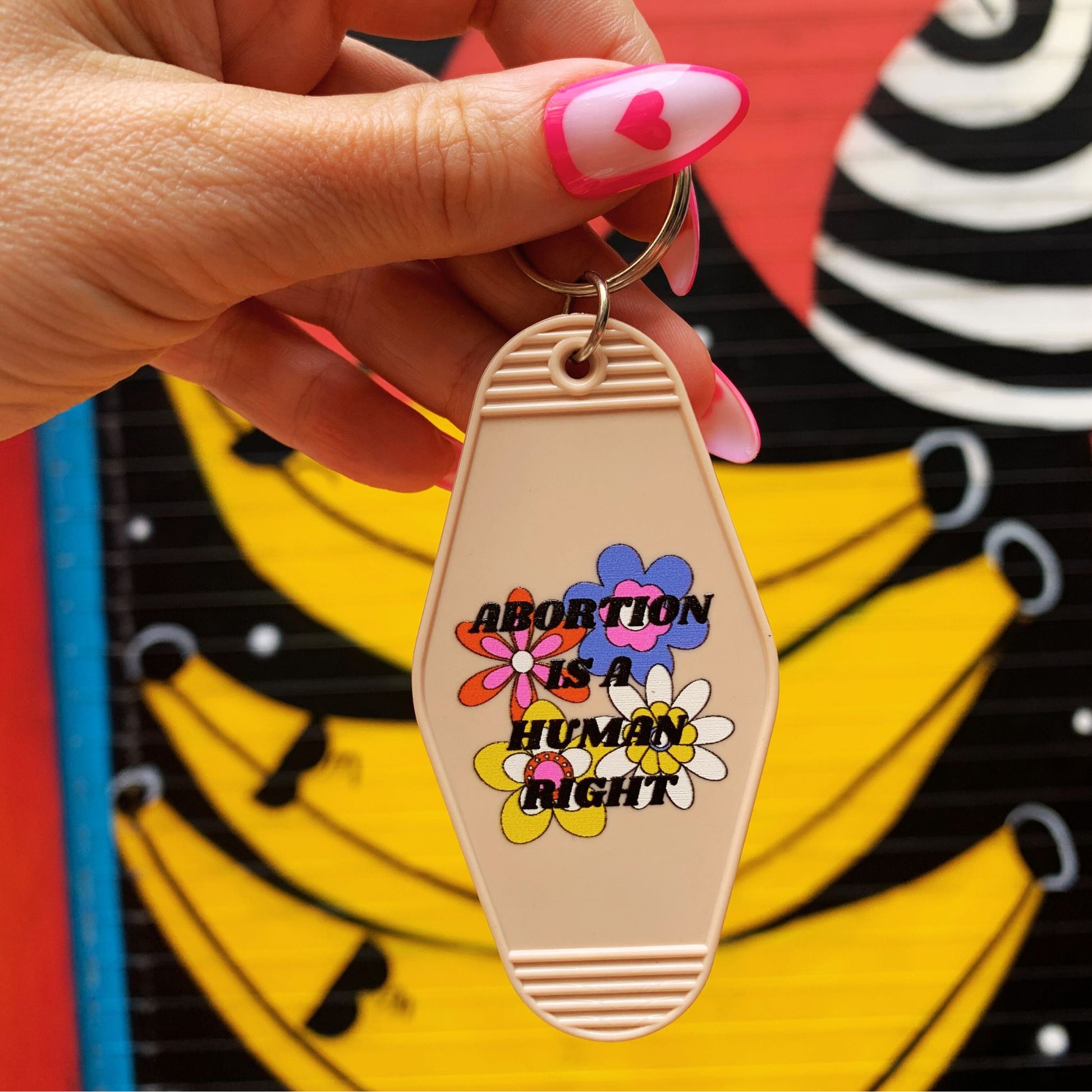 Abortion is a Human Right Keychain in Groovy '70s Flower Print