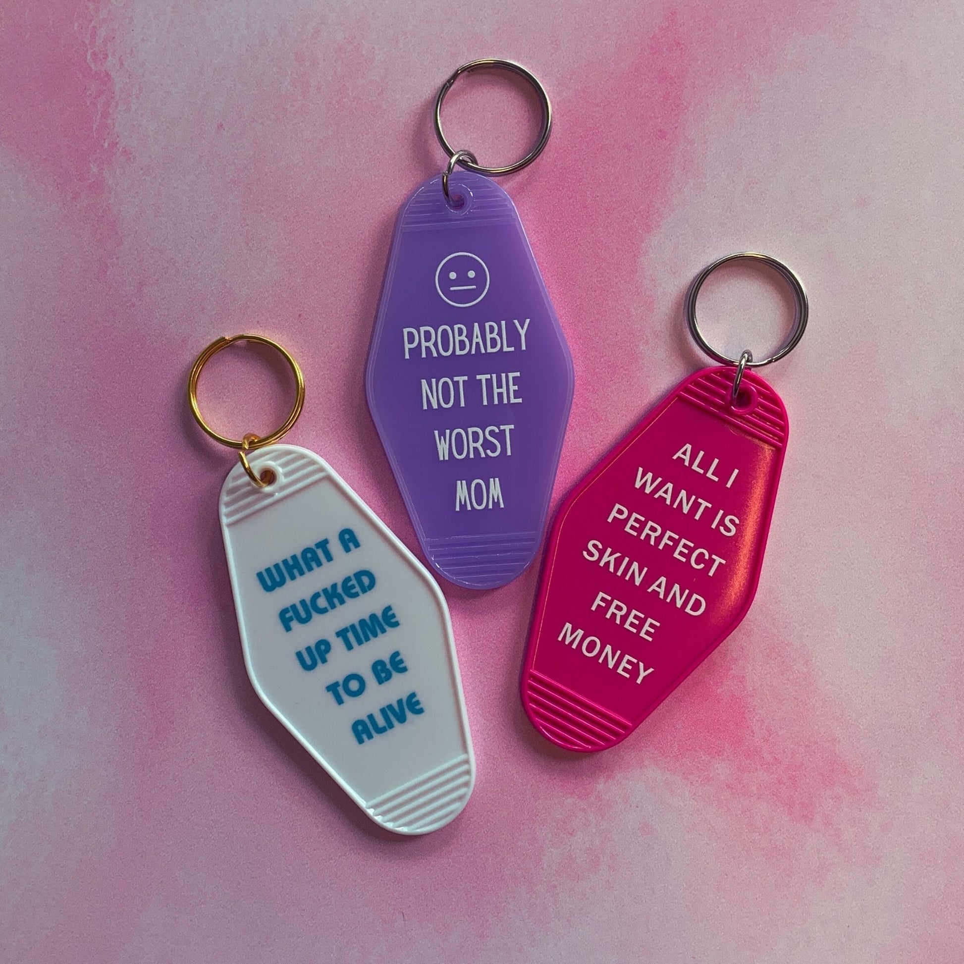 All I Want is Perfect Skin and Free Money Motel Style Keychain in Fuchsia Pink