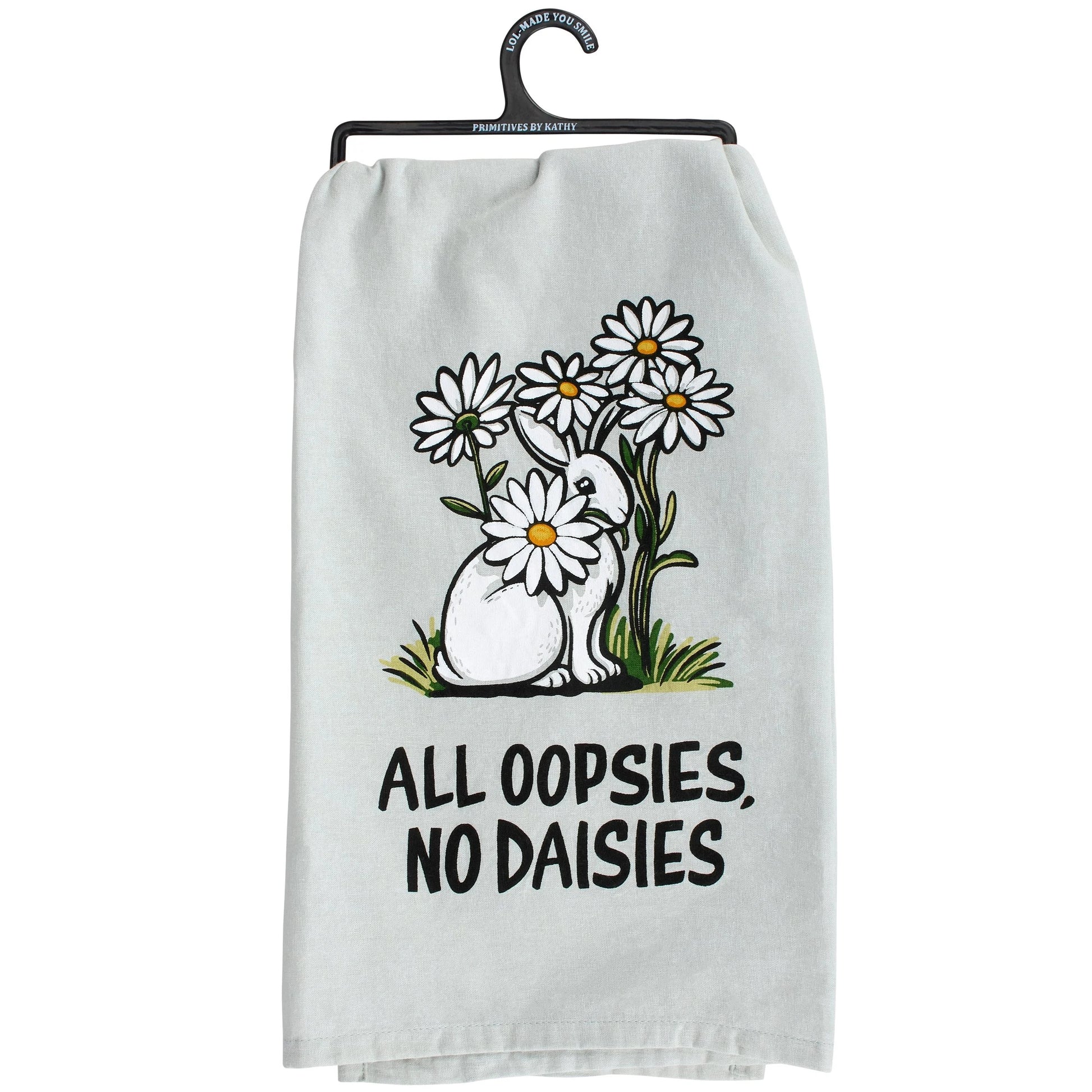 White towel with a bunny and daisies graphic and text 'All oopsies, no daisies' on a white background