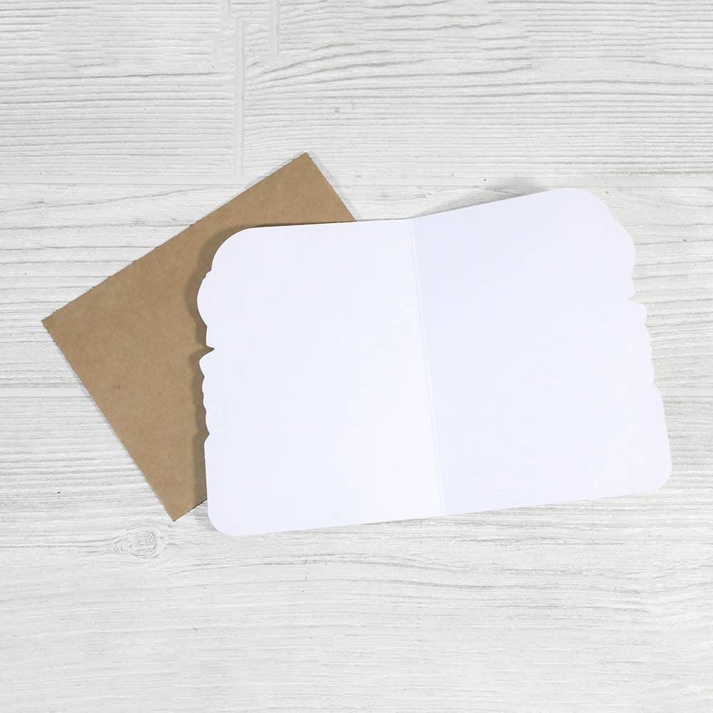 Inside of a blank greeting card with brown envelope