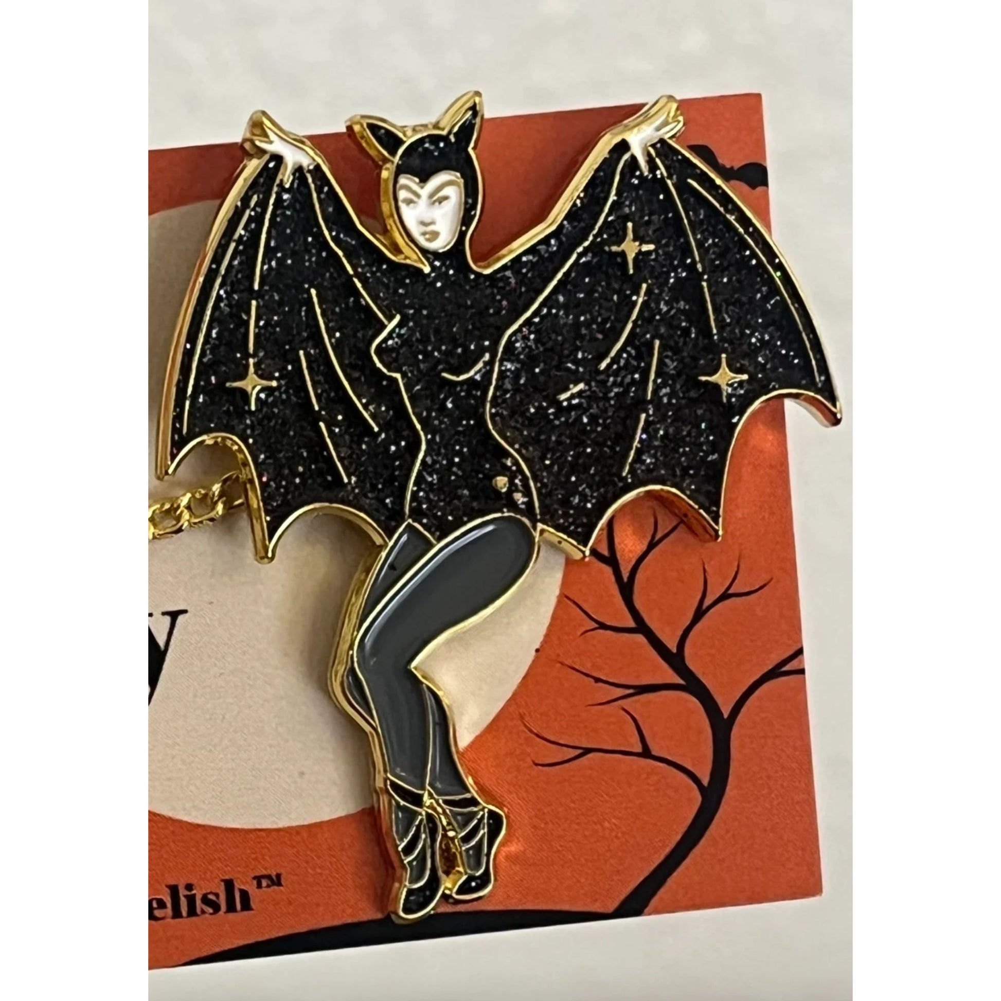 Vampire-themed enamel pin on a Halloween-themed card