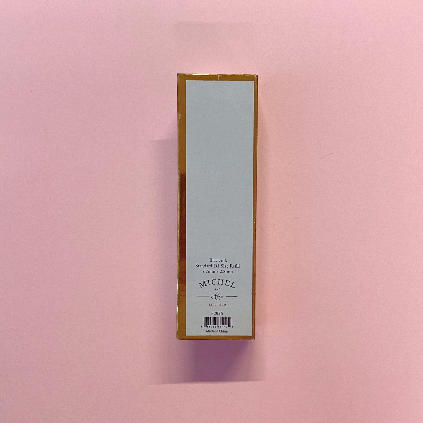 Rectangular box with a label on a pink background