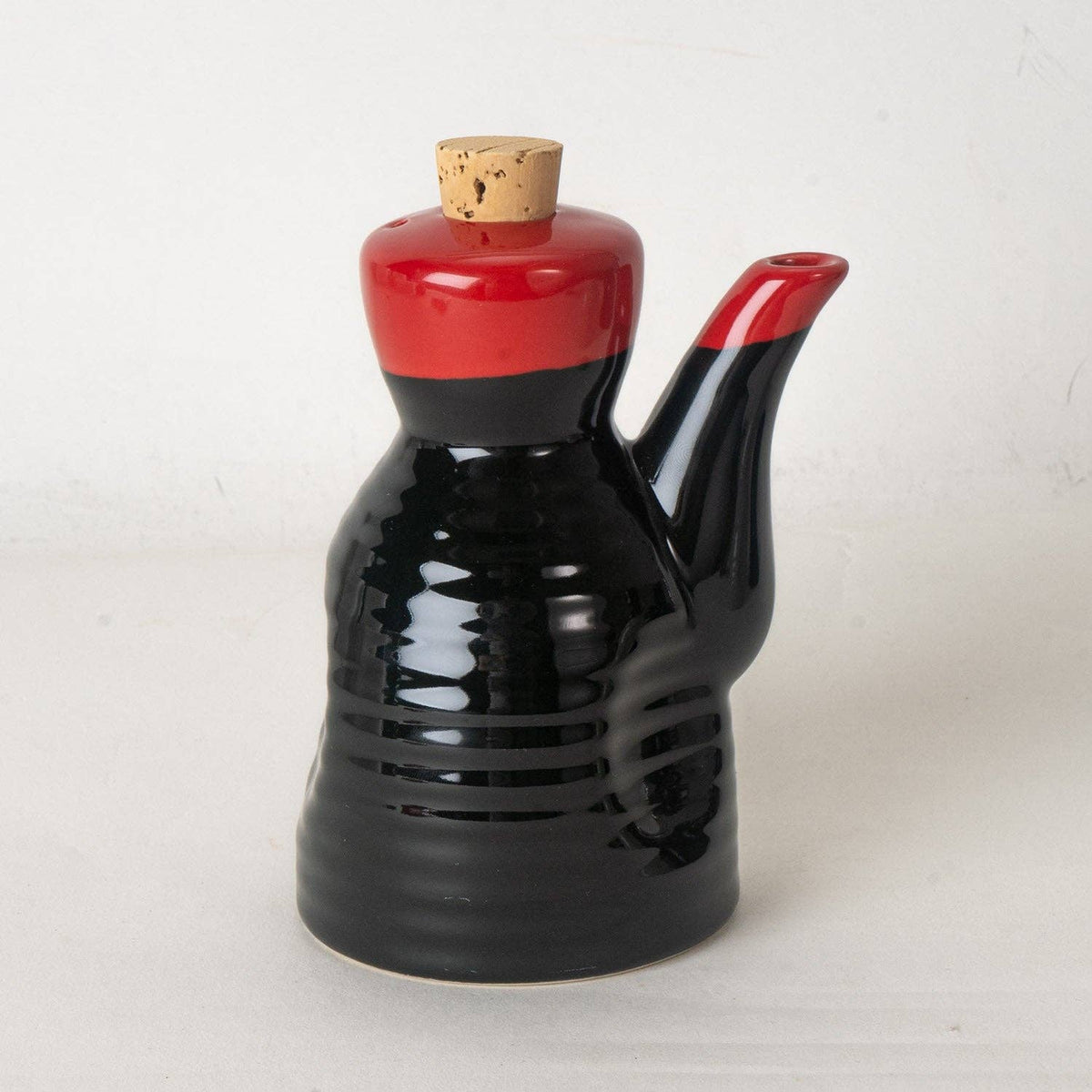 Black and red ceramic soy sauce dispenser