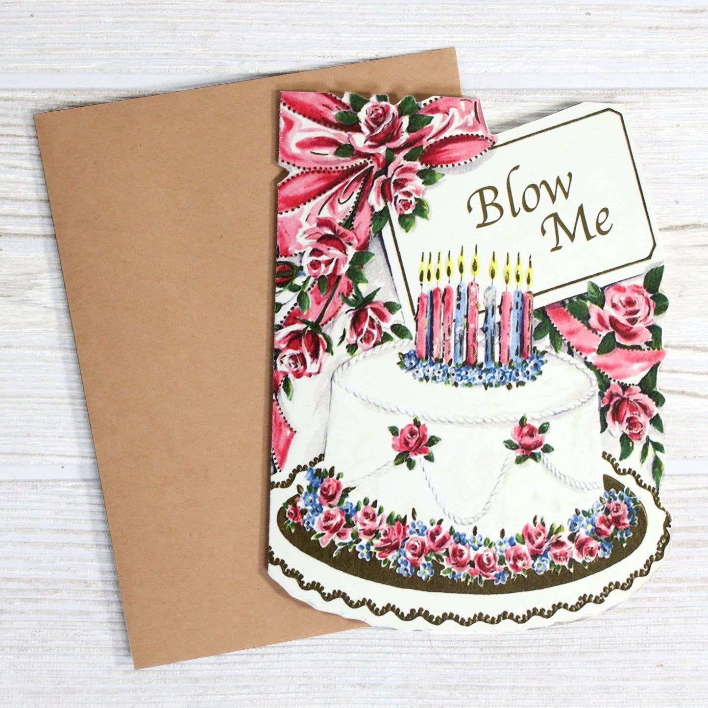 Birthday card with cake and candles design on a wooden surface