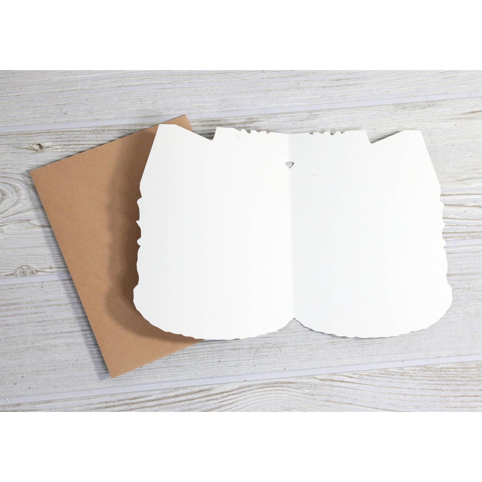 Inside of a blank greeting card with brown envelope