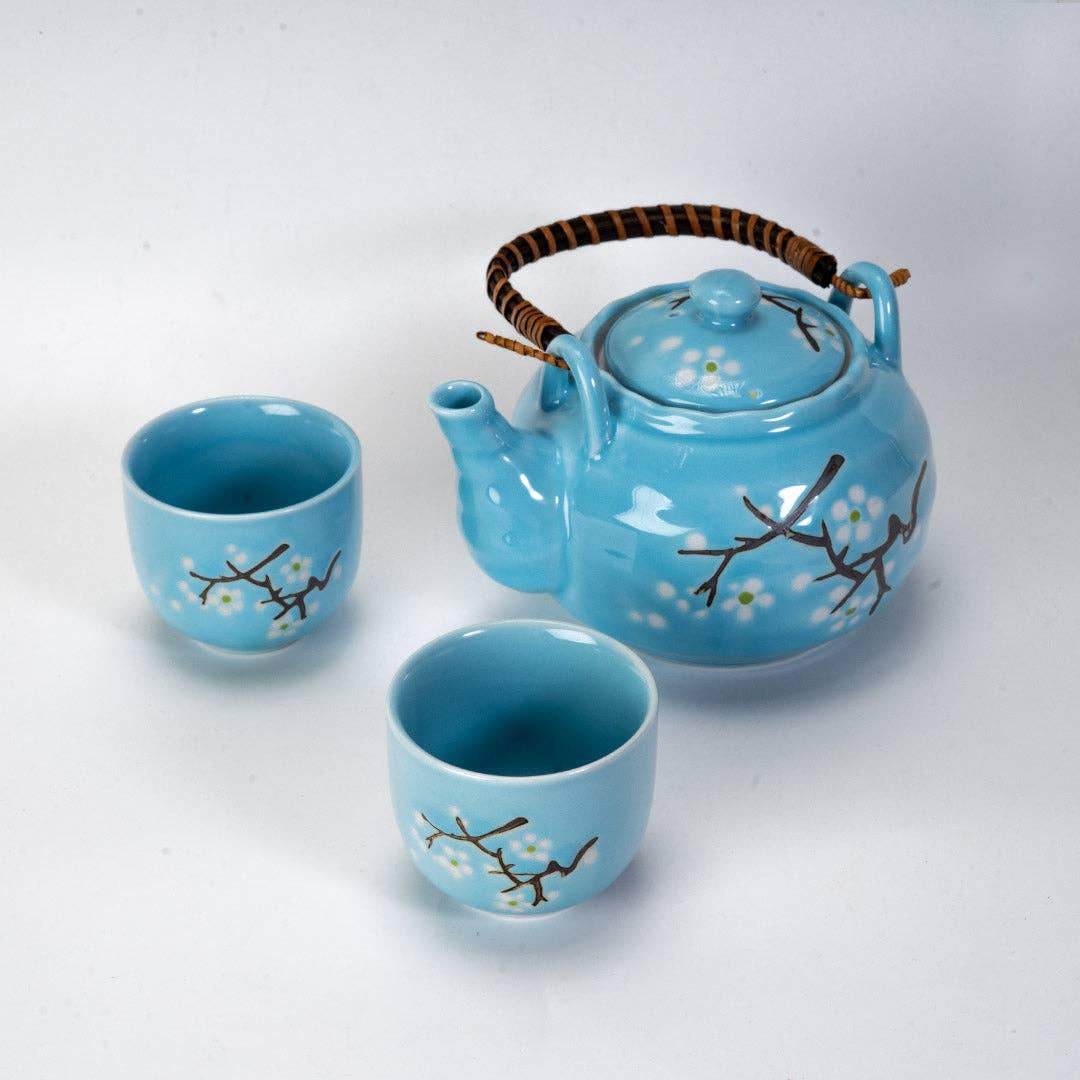 Ceramic teapot and two cups with floral design