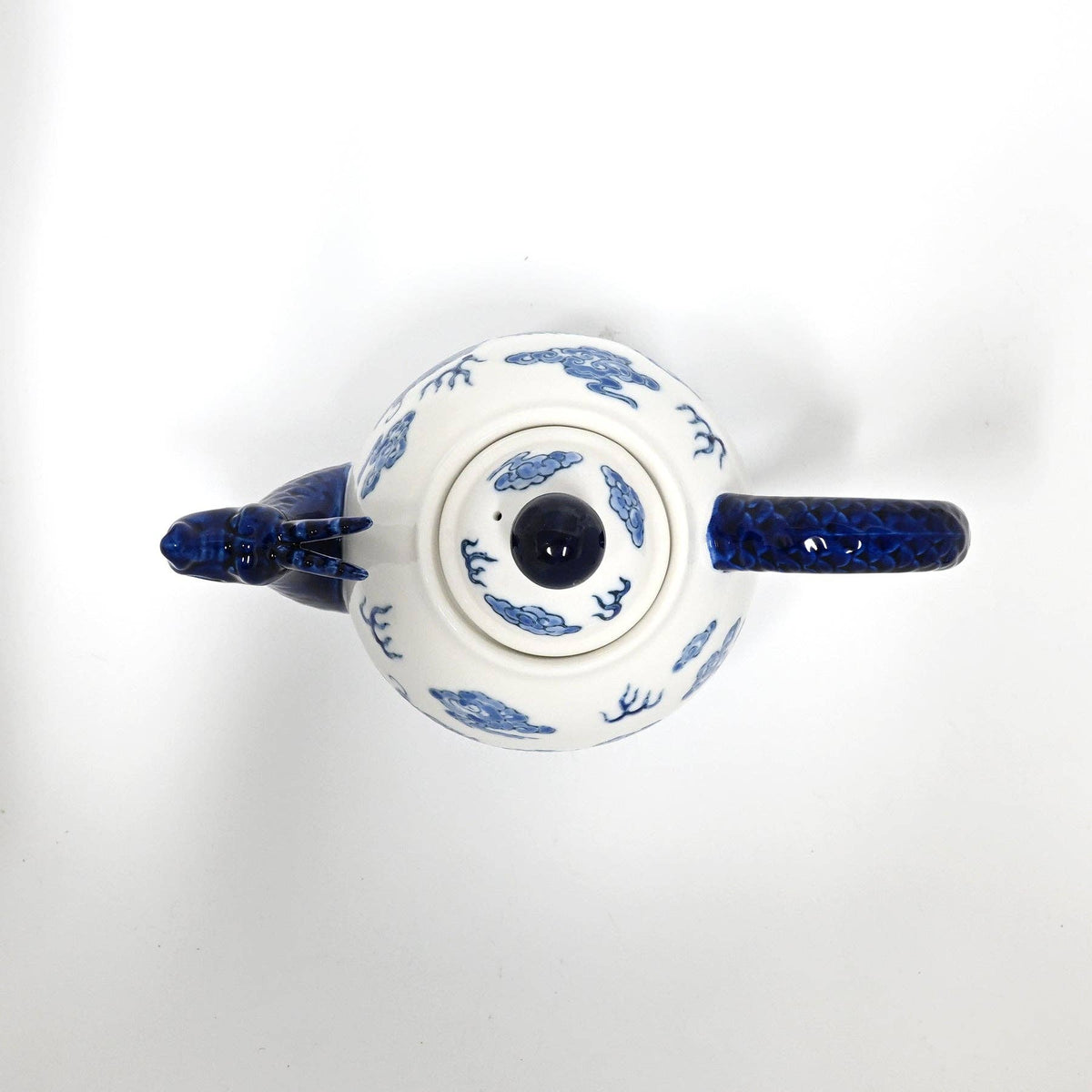 Ceramic teapot with blue floral patterns 
