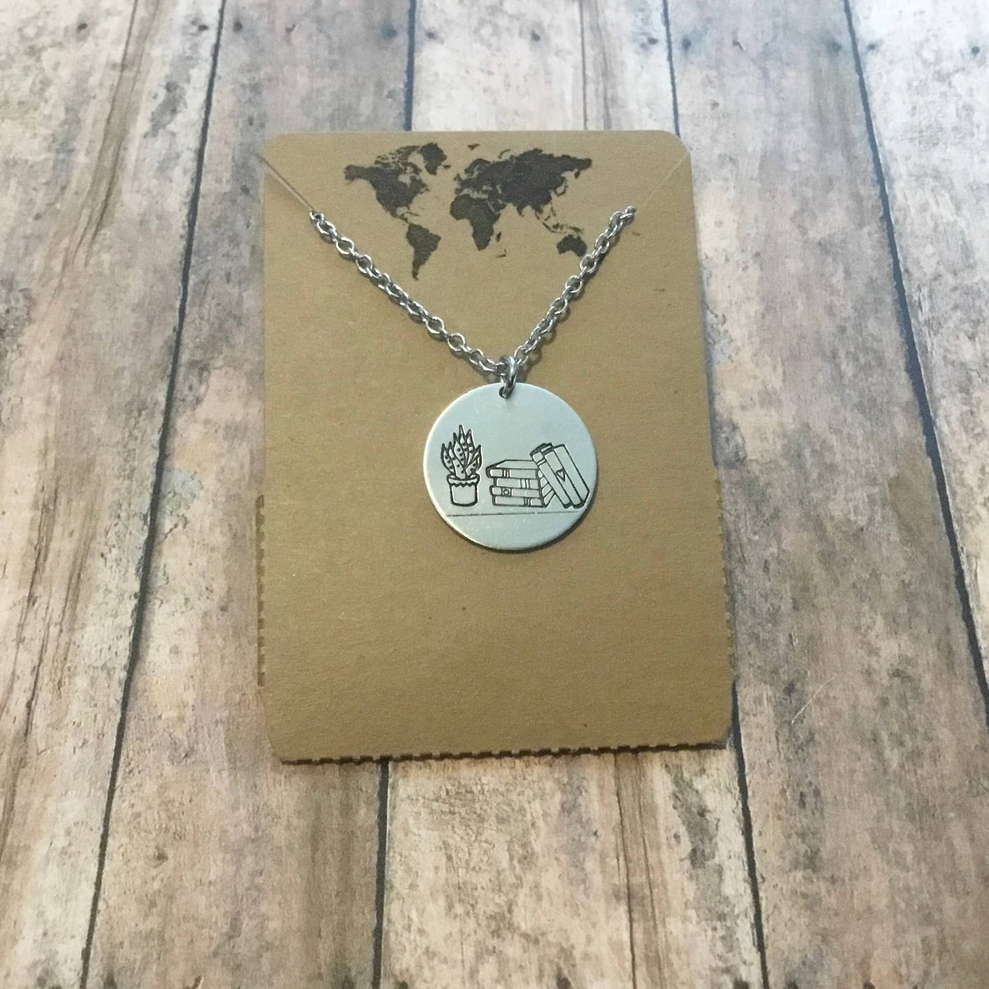 Books & Plants Handmade Necklace | Stack of Books with Plant Circular Stamped Pendant Necklace in Silver