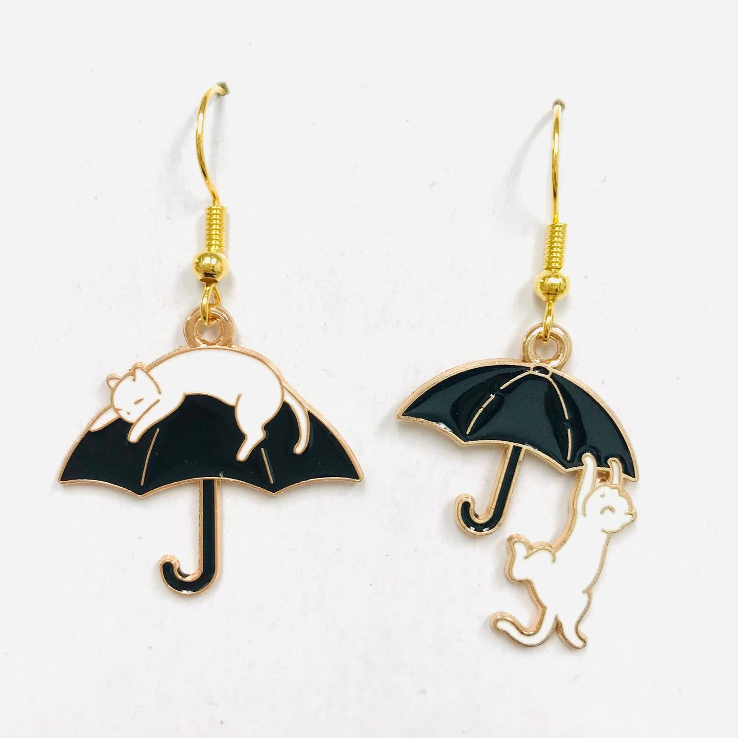 Cat climbing an umbrella earrings 