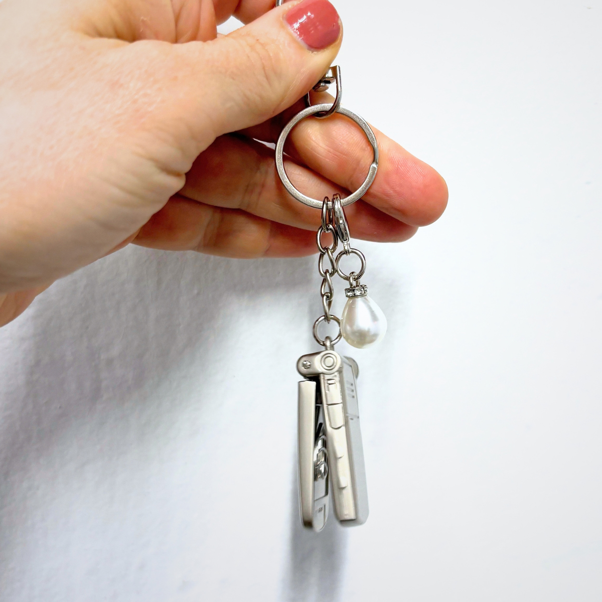 Charmed Pearl Y2K Flip Phone Fidget Keychain | Spinning Silver Flip Phone Charm-GetBullish-The Bullish Store