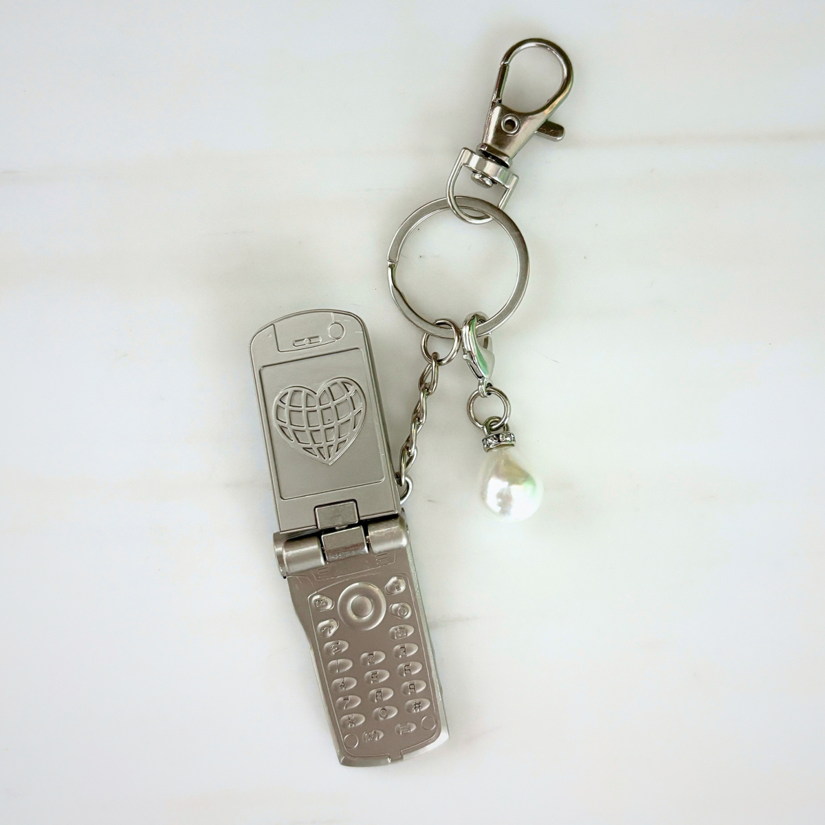 Charmed Pearl Y2K Flip Phone Fidget Keychain | Spinning Silver Flip Phone Charm-GetBullish-The Bullish Store