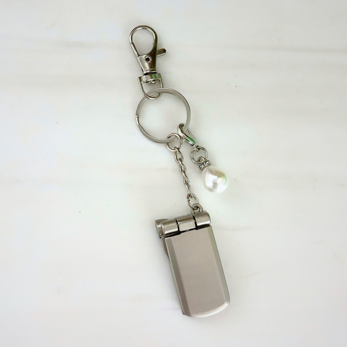 Charmed Pearl Y2K Flip Phone Fidget Keychain | Spinning Silver Flip Phone Charm-GetBullish-The Bullish Store