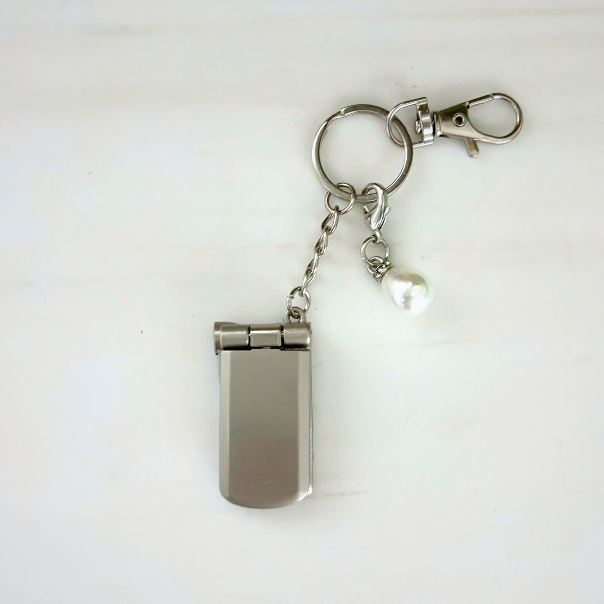 Charmed Pearl Y2K Flip Phone Fidget Keychain | Spinning Silver Flip Phone Charm-GetBullish-The Bullish Store