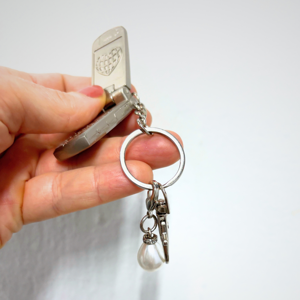Charmed Pearl Y2K Flip Phone Fidget Keychain | Spinning Silver Flip Phone Charm-GetBullish-The Bullish Store