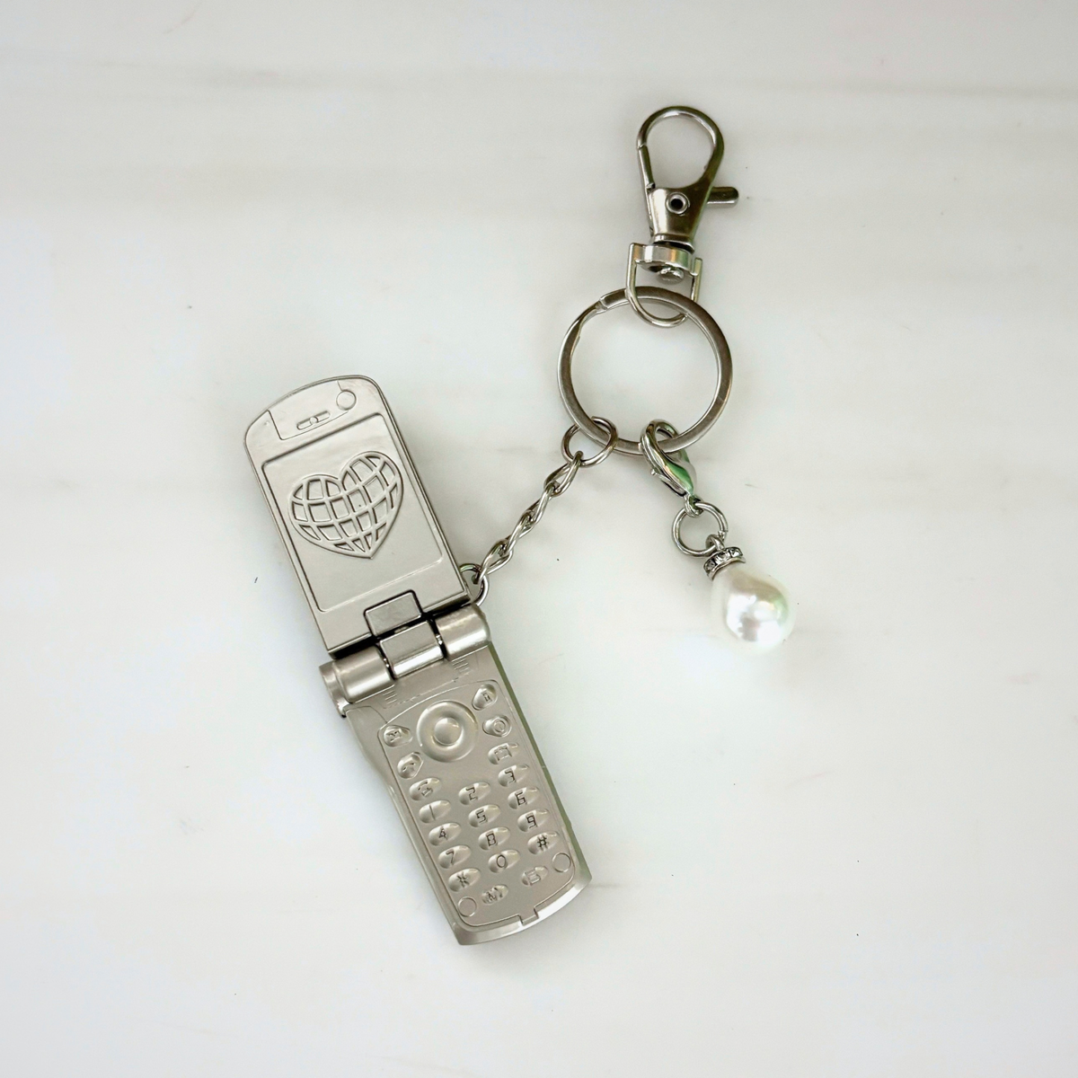 Charmed Pearl Y2K Flip Phone Fidget Keychain | Spinning Silver Flip Phone Charm-GetBullish-The Bullish Store