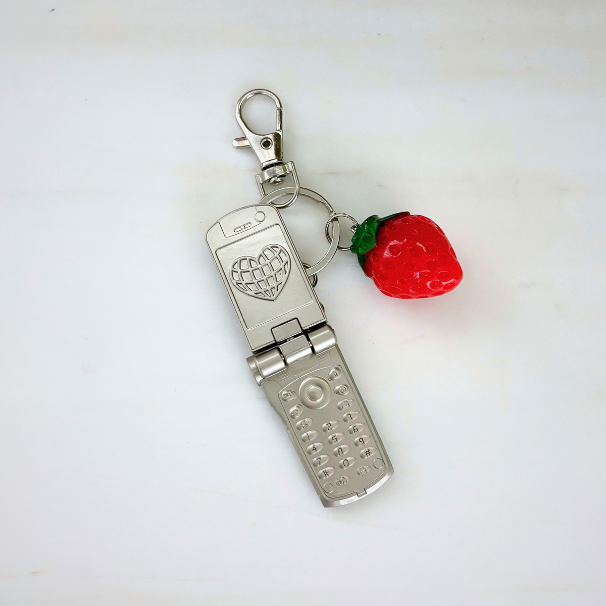 Charmed Strawberry Y2K Flip Phone Fidget Keychain | Spinning Silver Flip Phone Charm-GetBullish-The Bullish Store
