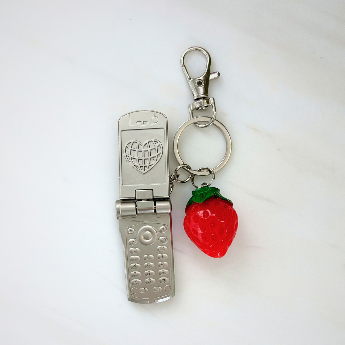 Charmed Strawberry Y2K Flip Phone Fidget Keychain | Spinning Silver Flip Phone Charm-GetBullish-The Bullish Store