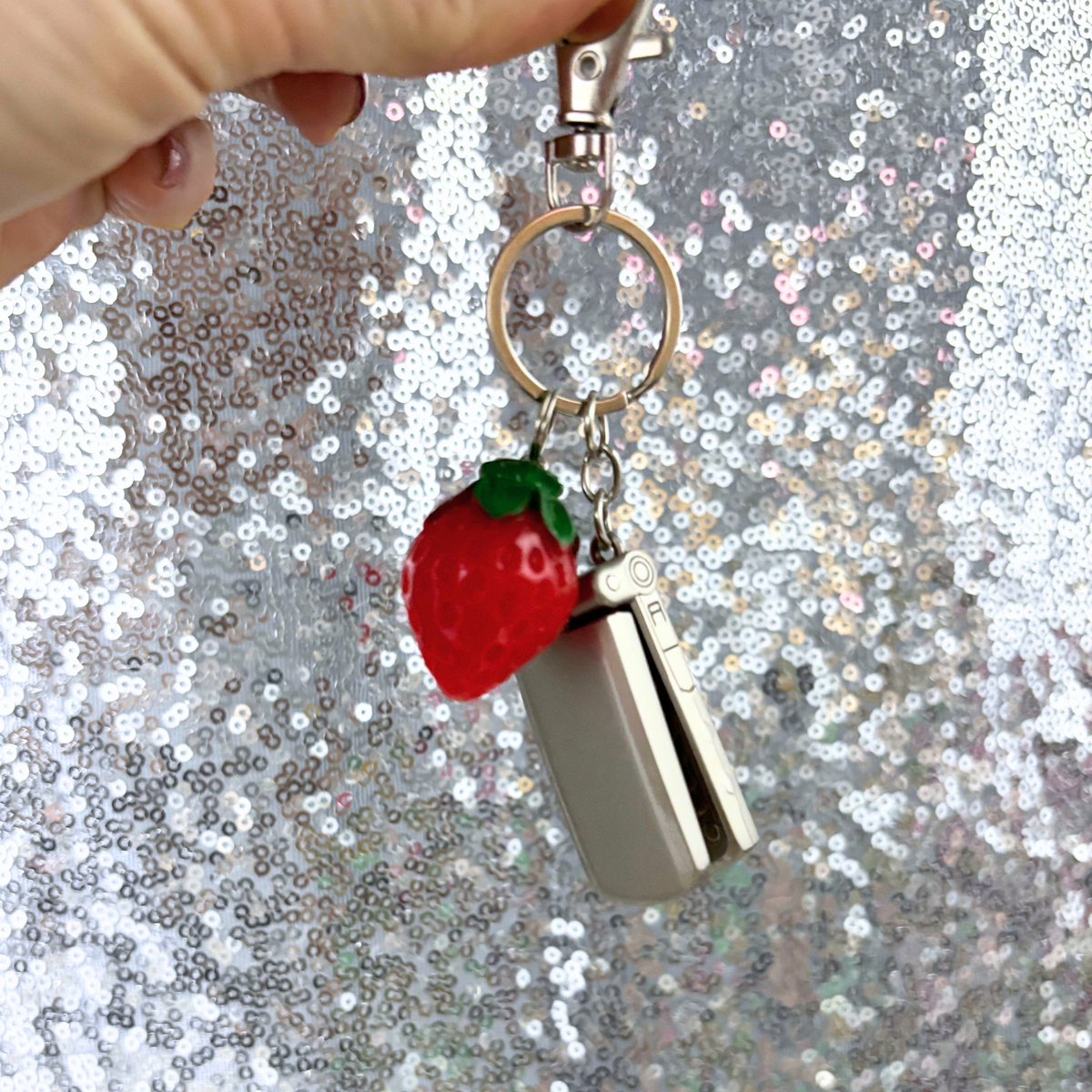 Charmed Strawberry Y2K Flip Phone Fidget Keychain | Spinning Silver Flip Phone Charm-GetBullish-The Bullish Store