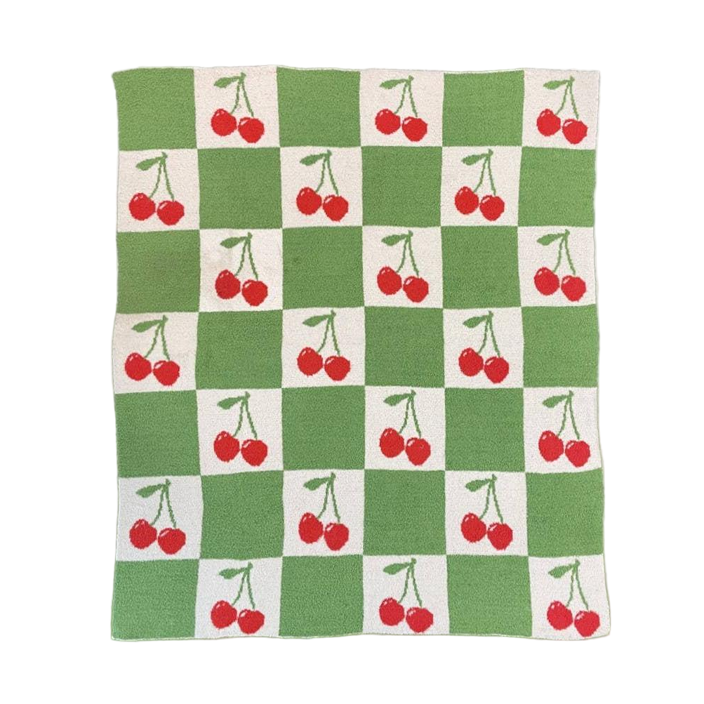 Checkered blanket with cherry pattern on a white background