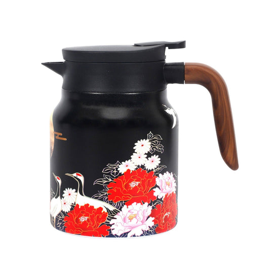 Black tea kettle with floral and bird design