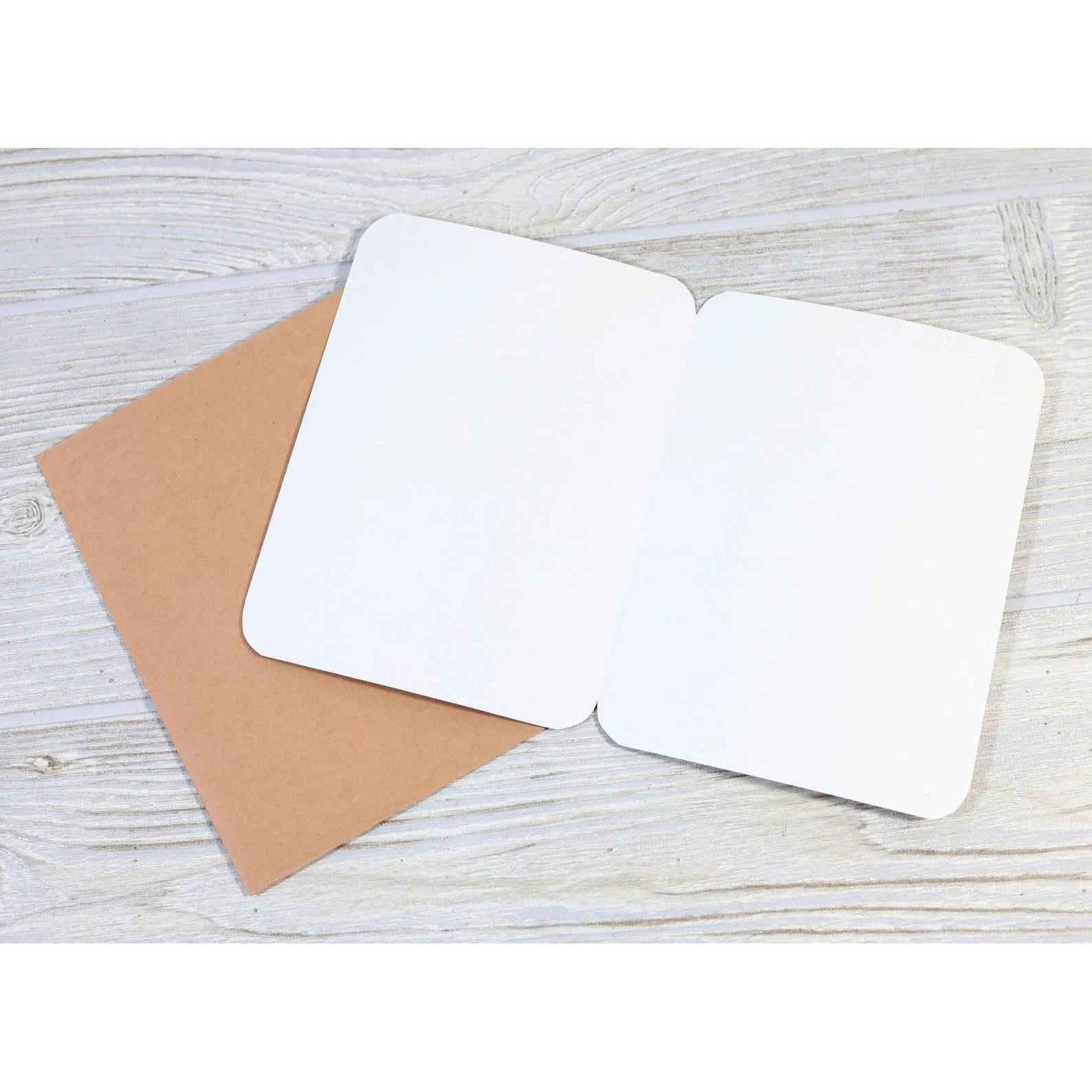 Inside of a blank greeting card with brown envelope